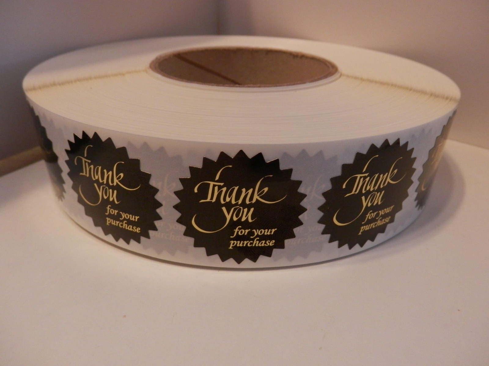Thank You For Your Purchase Label 1.5″ Starburst gold letters black bkg 250/rl