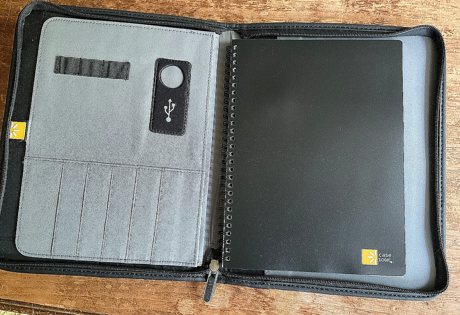 CHESTNUT WESTERN FLORAL EMBOSSED COWHIDE LEATHER NOTEBOOK ON A CASE LOGIC BASE