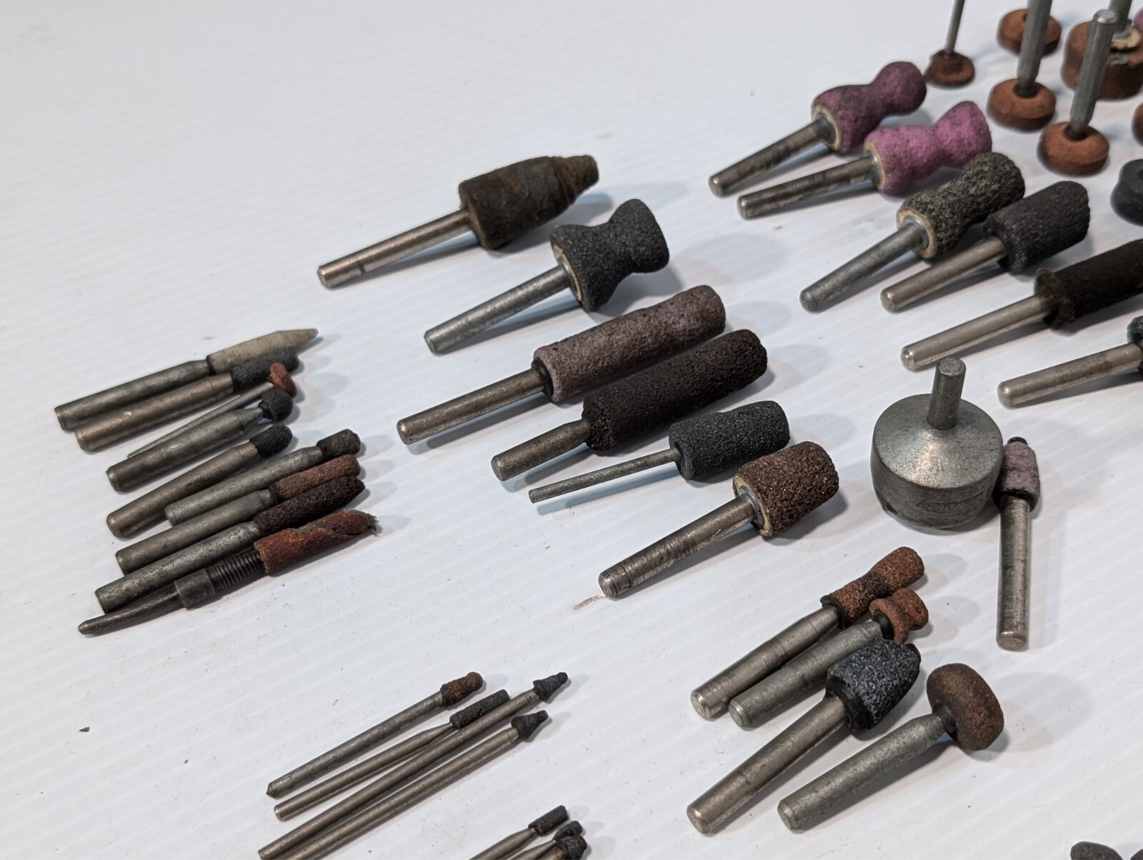 Lot of 144 mounted grinding wheels on shaft as shown, various sizes, shapes, …