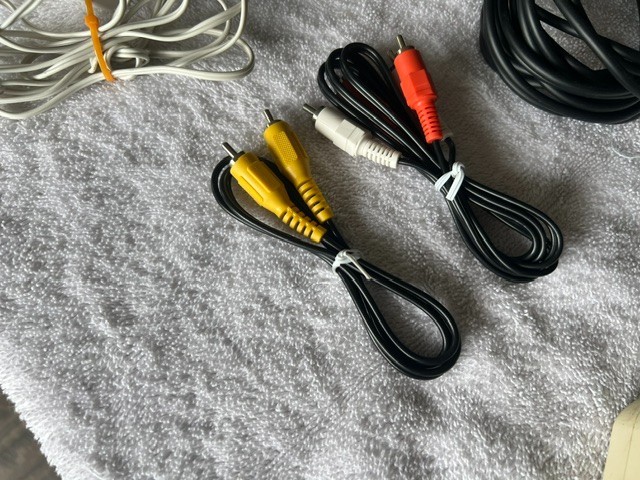 LOT OF MISC COMPUTER / PHONE / TV CABLES WIRES SPEAKERS CHARGERS