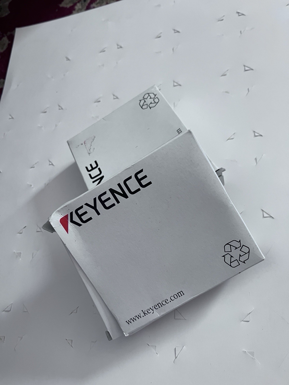 This is a Keyence LR-ZB100CP self-contained CMOS laser sensor.