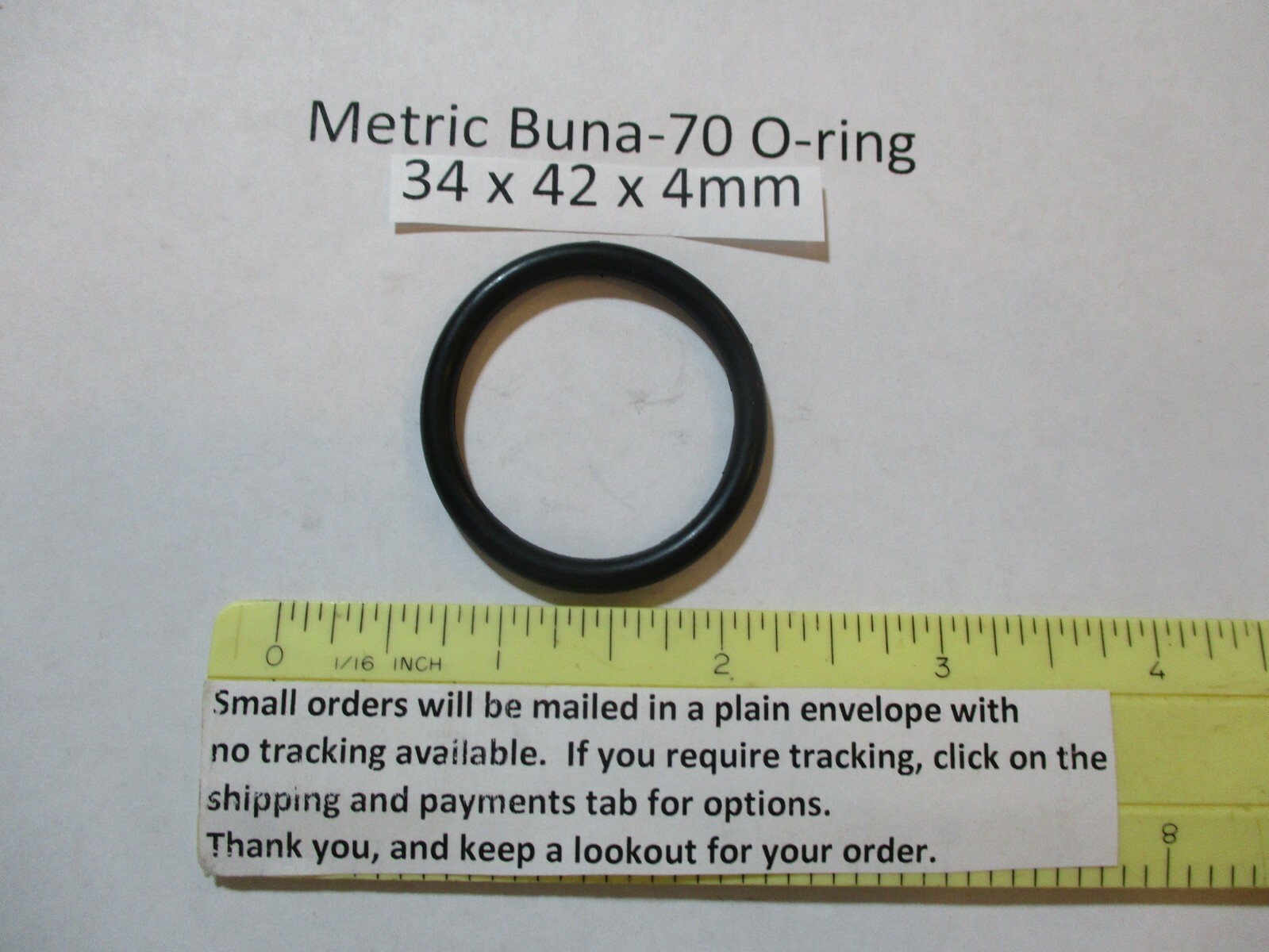 34mm ID x 42mm OD x 4mm thick O-ring. Buna-70. Quan 1.