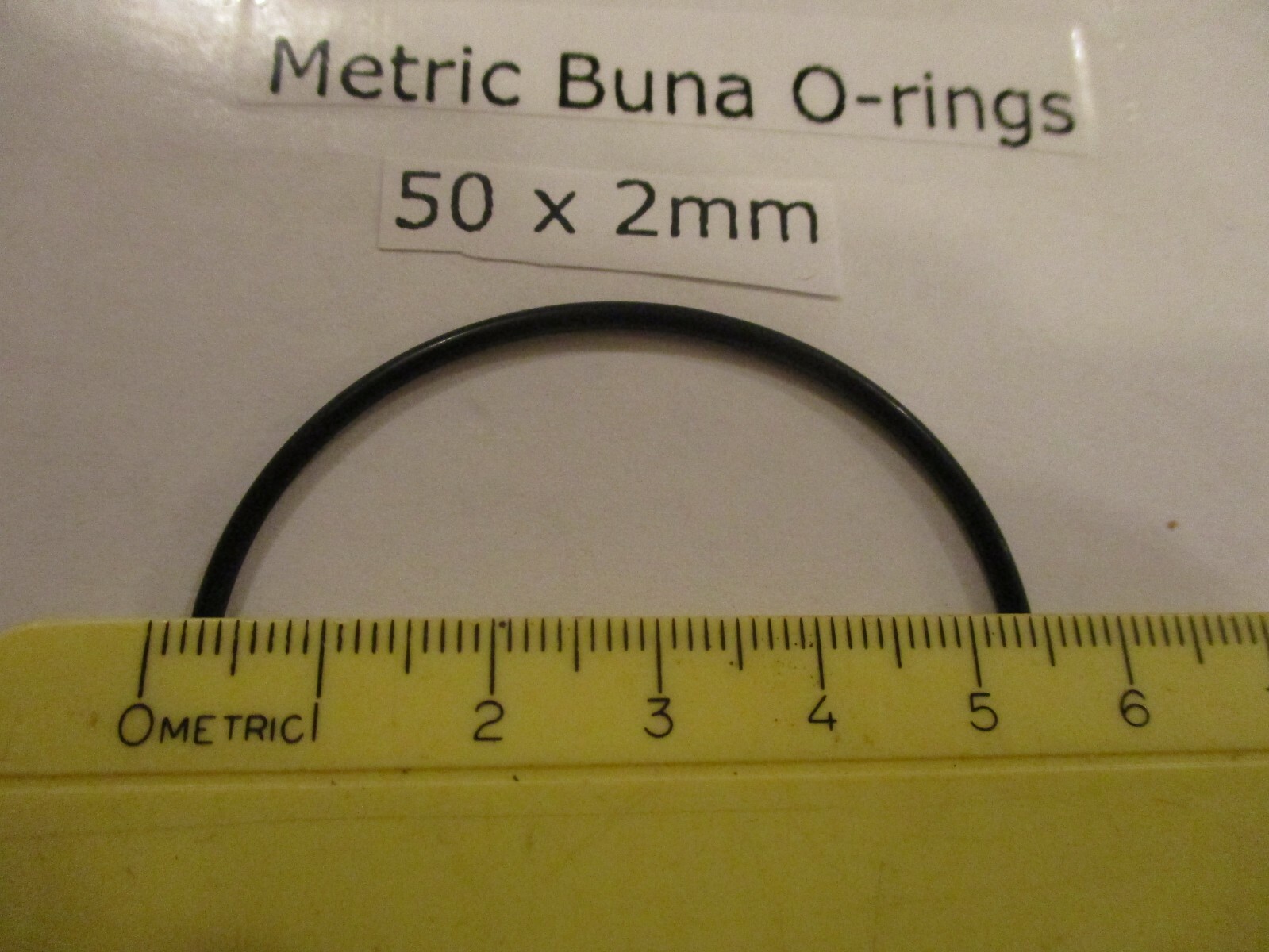 50mm ID x 54mm OD x 2mm thick O-ring. Buna-70. Quan 1.