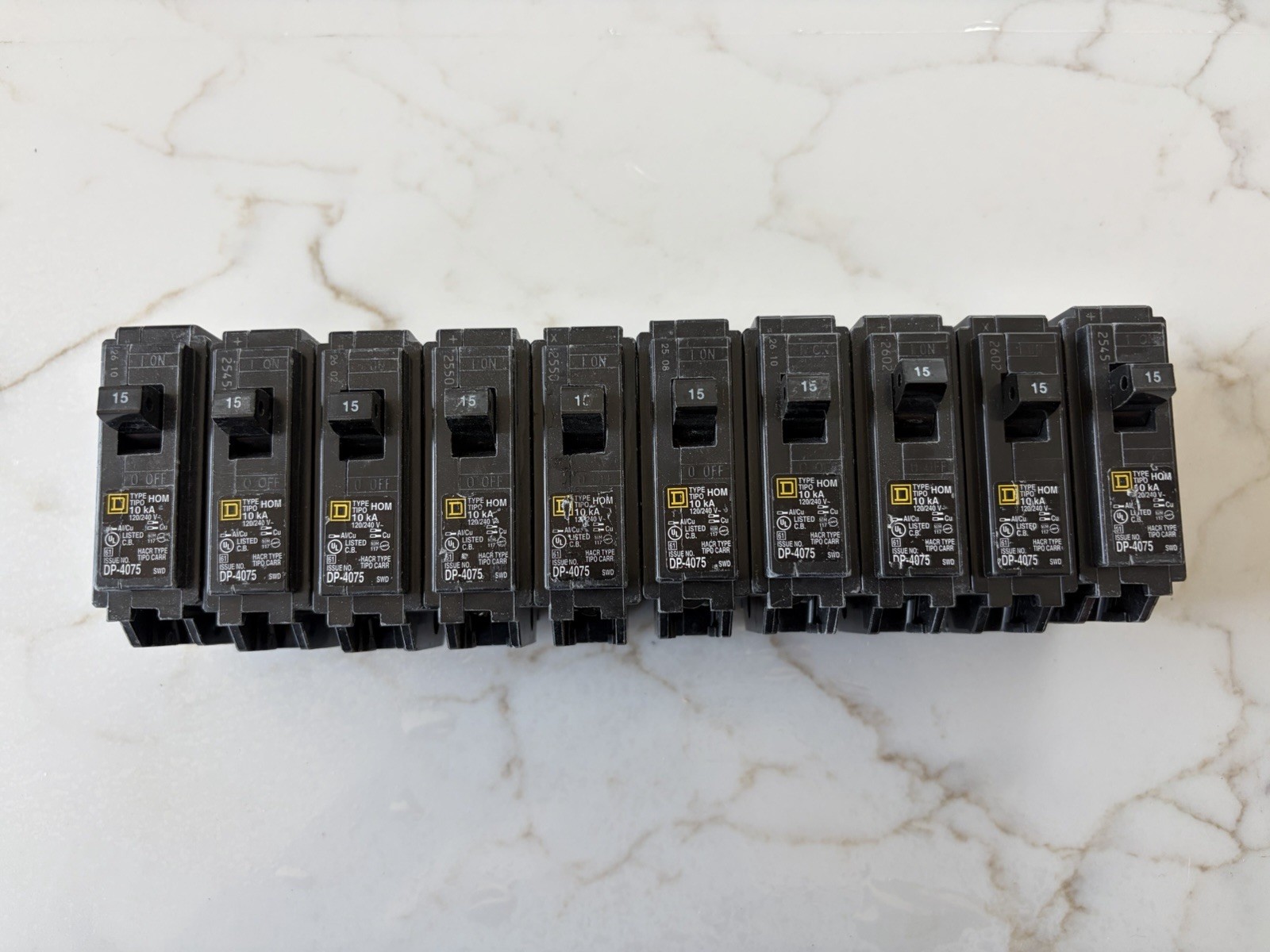 (10) Square D – HOM115CP Homeline 15 Amp Single-Pole Circuit Breaker