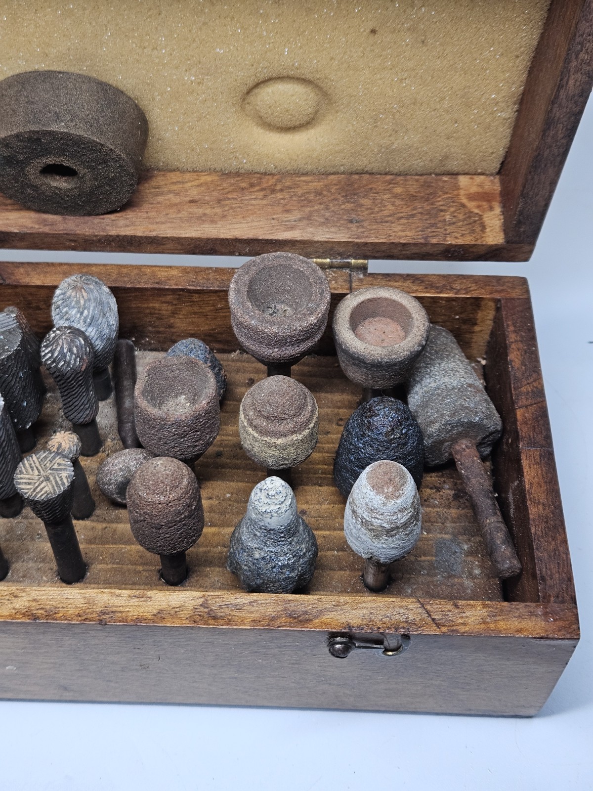 Lot of 30+ mounted grinding wheels on shaft as shown, various sizes With Case
