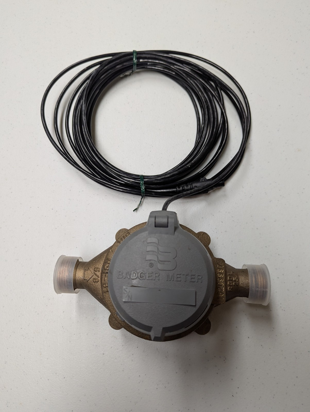 Used Badger model 25 5/8″ brass water meter with HR E lcd register