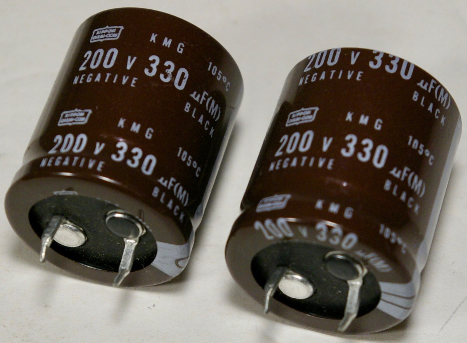 330uF 200V 105°C 25x30mm Snap In Electrolytic Capacitor Nippon Chem-Con Quan 2