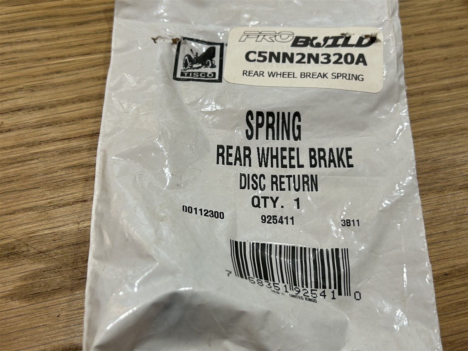Tisco New Old Stock Part # C5NN2N320A SPRING REAR WHEEL BRAKE DISC RETURN