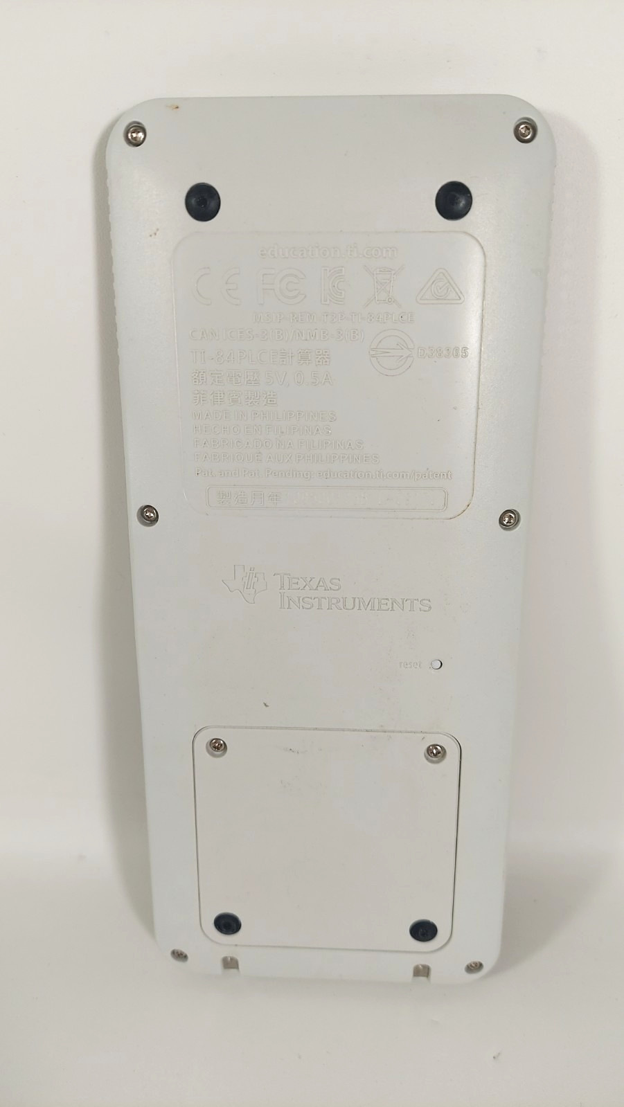 Texas Instruments Ti 84 Plus Ce Graphing Calculator with a charger cable