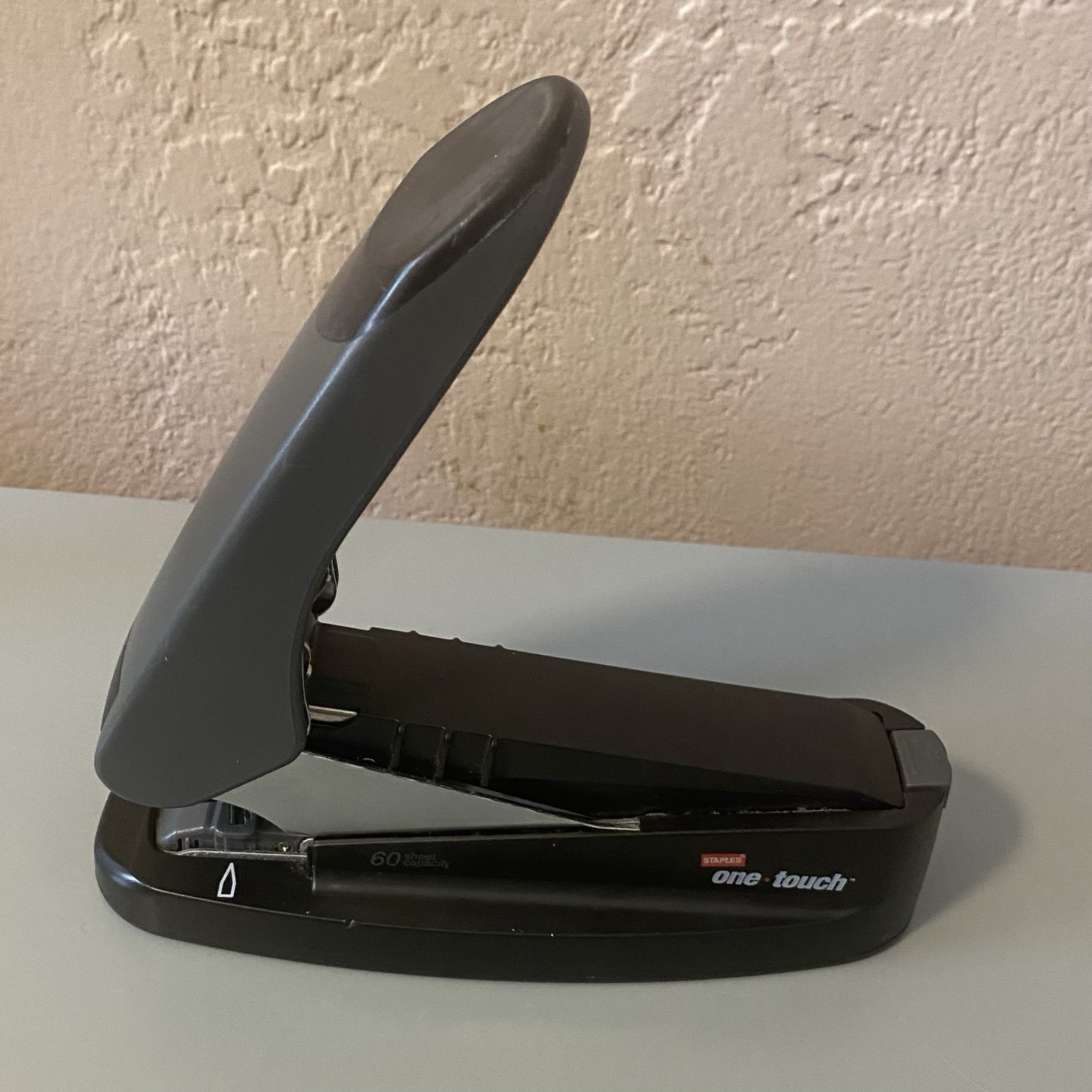 Staples One Touch stapler Up To 60 Pages At A Time. Holds Extra Staples