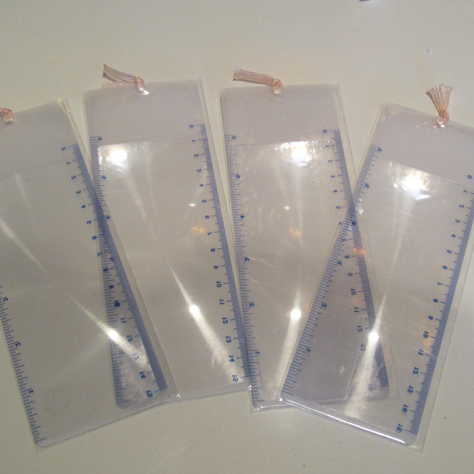 Lot of 4 Large Bookmark Magnifier-2x- inch and mm ruler 7″ long-Pink ribbon