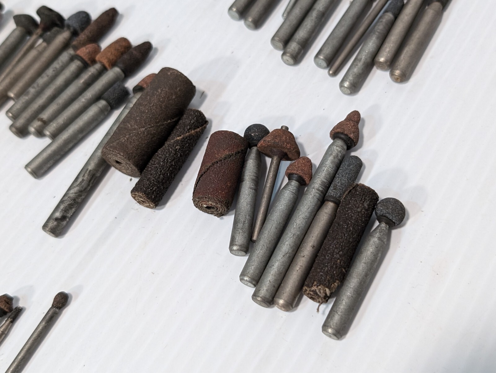 Lot of 144 mounted grinding wheels on shaft as shown, various sizes, shapes, …