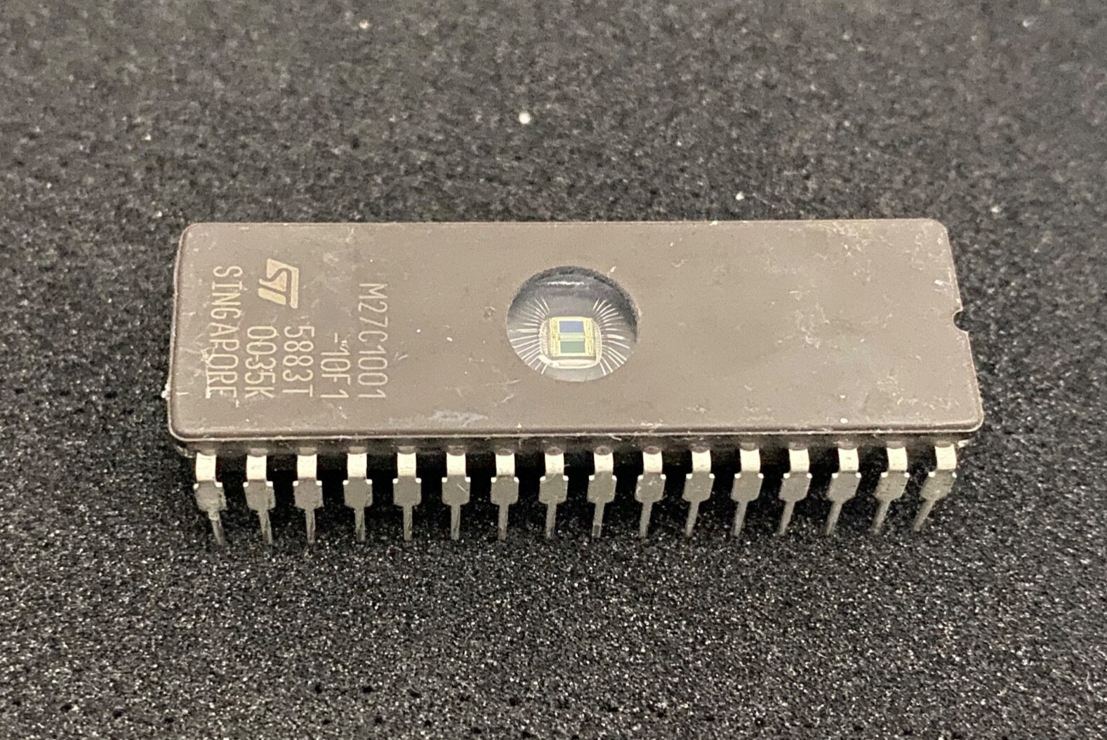 STMicroelectronics M27C1001-10F1 UV EPROM memory integrated circuit dates Vary