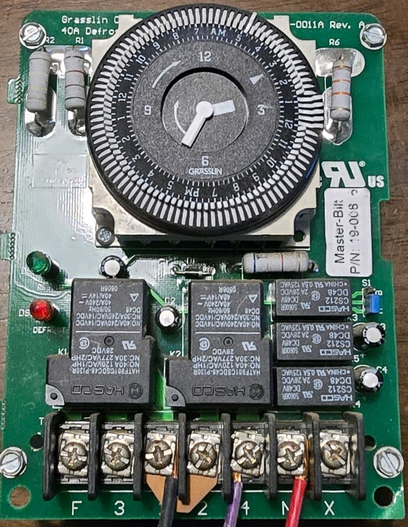 Grasslin electromechanical defrost timer, manage cooling and defrost cycles.