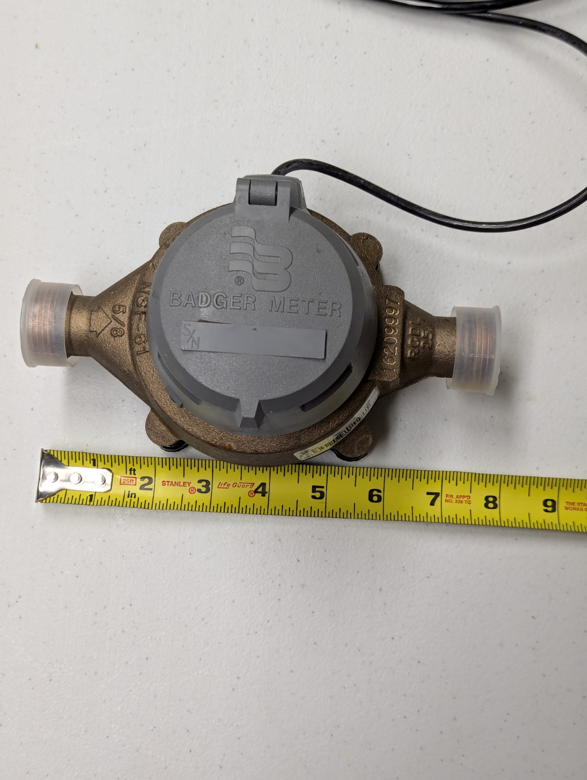 Used Badger model 25 5/8″ brass water meter with HR E lcd register