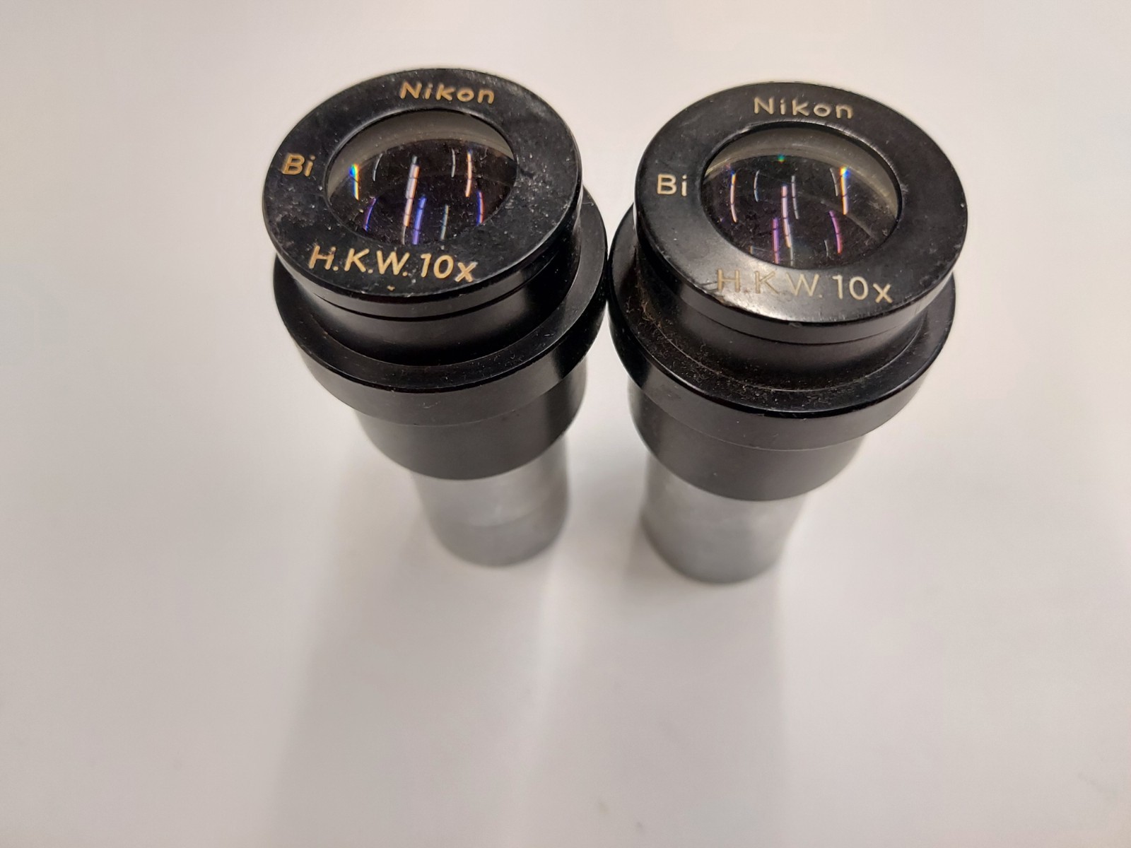 Lot of 2 Nikon H.K.W. 10x Microscope Eyepieces