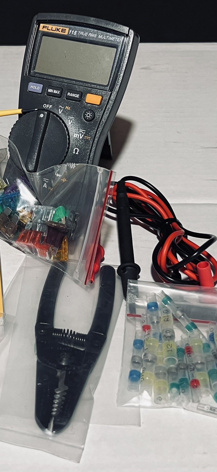 Fluke 115 True RMS Multimeter along with many Extras.